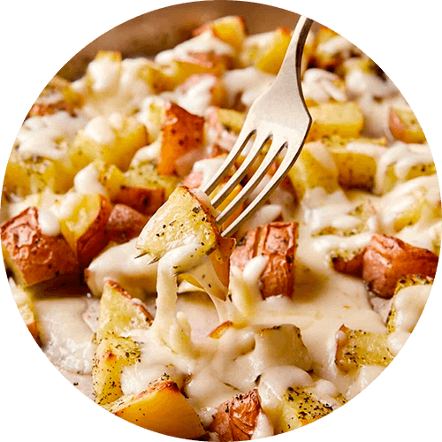 Cubos de Papa con Finas Hierbas y Queso Fundido